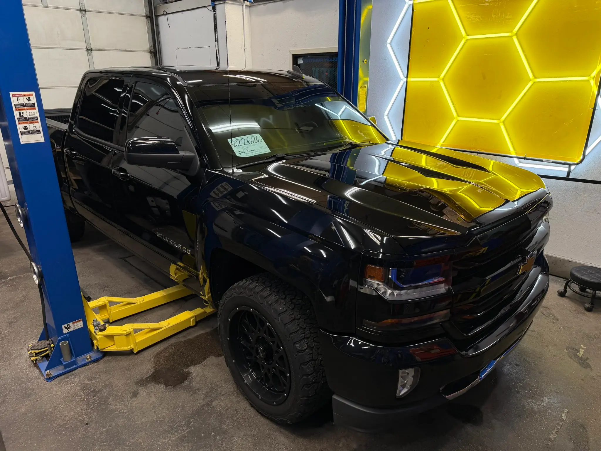 Black Chevrolet Silverado displaying deep reflections after ceramic coating