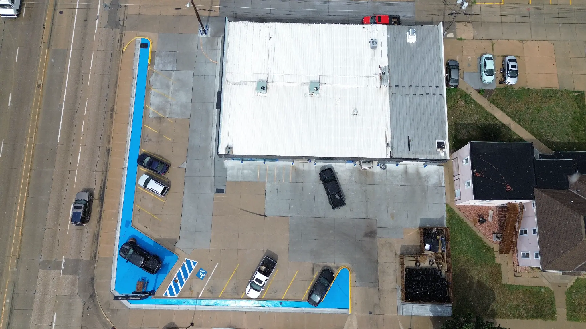 Overhead aerial view of the full shop property and parking layout