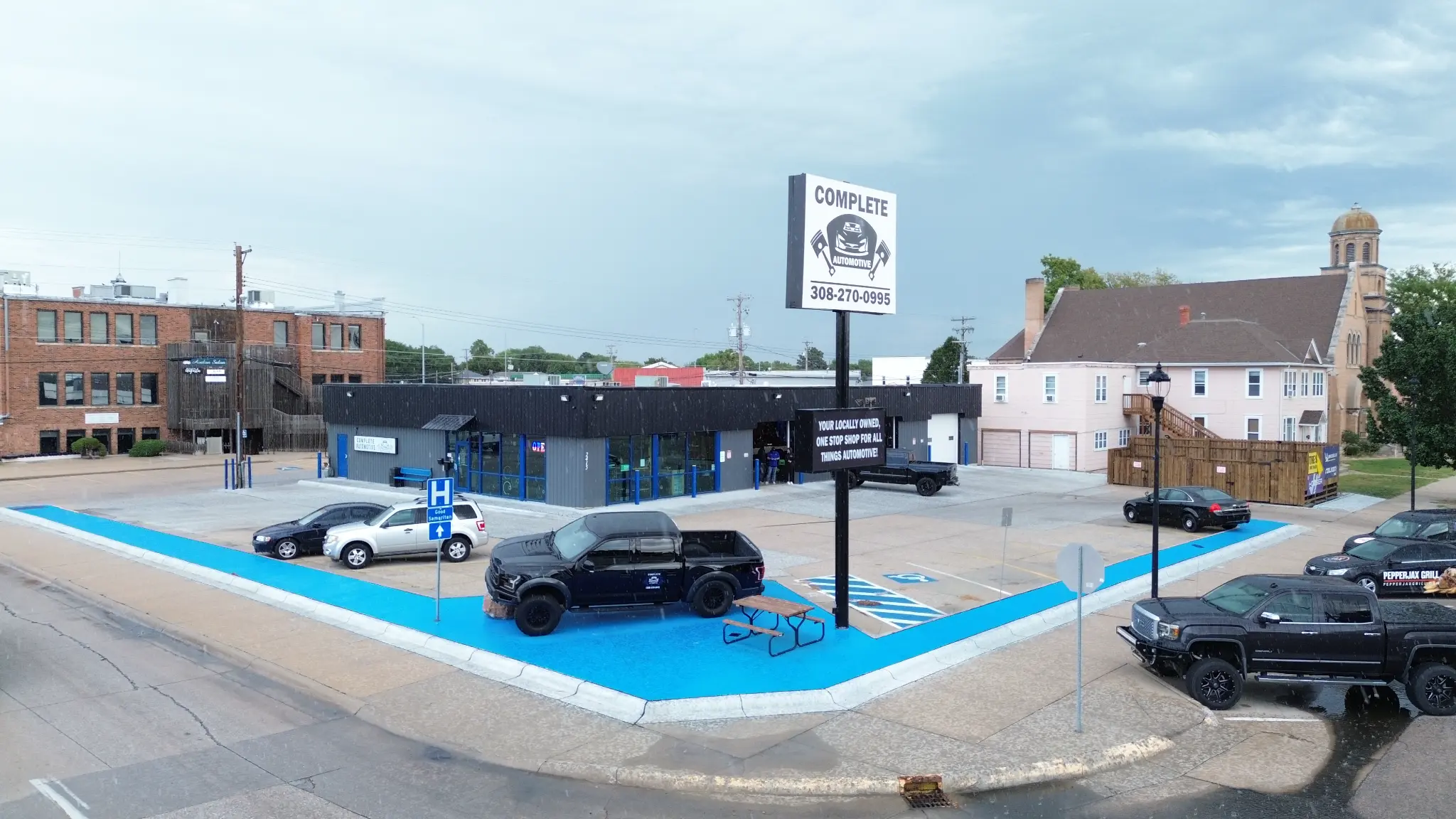 Aerial view of the roadside sign, front lot, and shop
