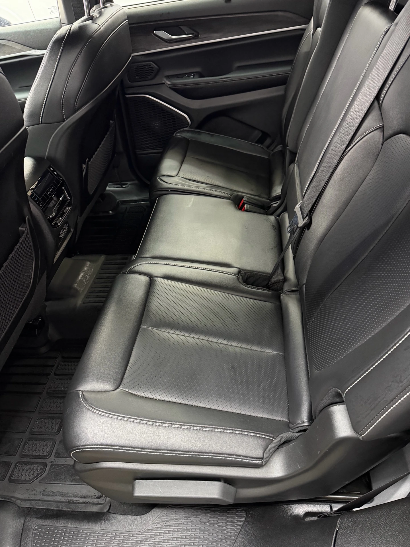 Black leather rear seating, rear door trim and floor mats inside the Jeep