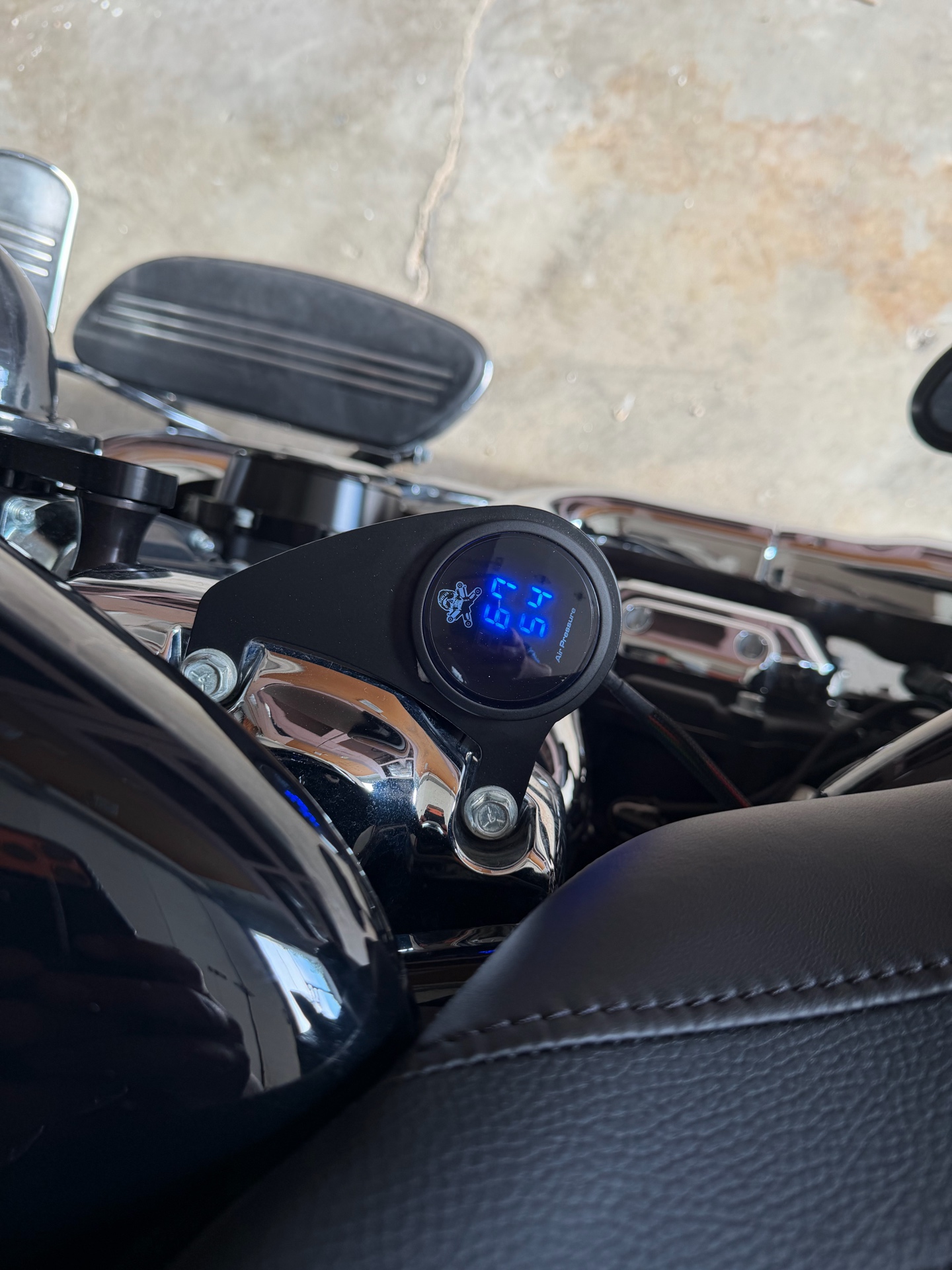 Digital air-pressure gauge installed on a motorcycle