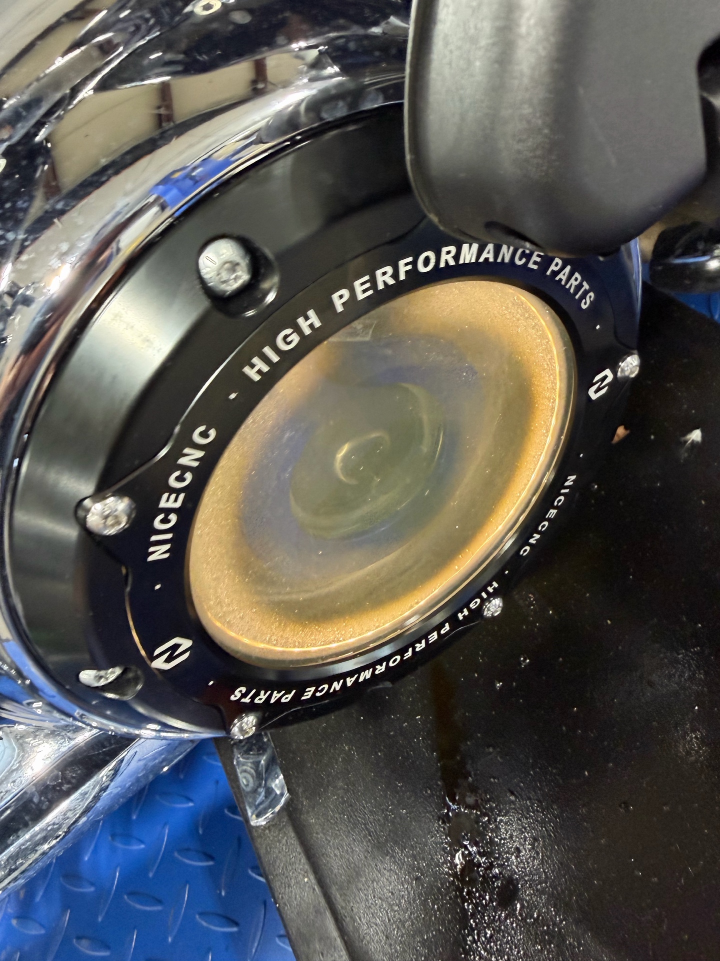 Angled close view of a clear motorcycle engine cover