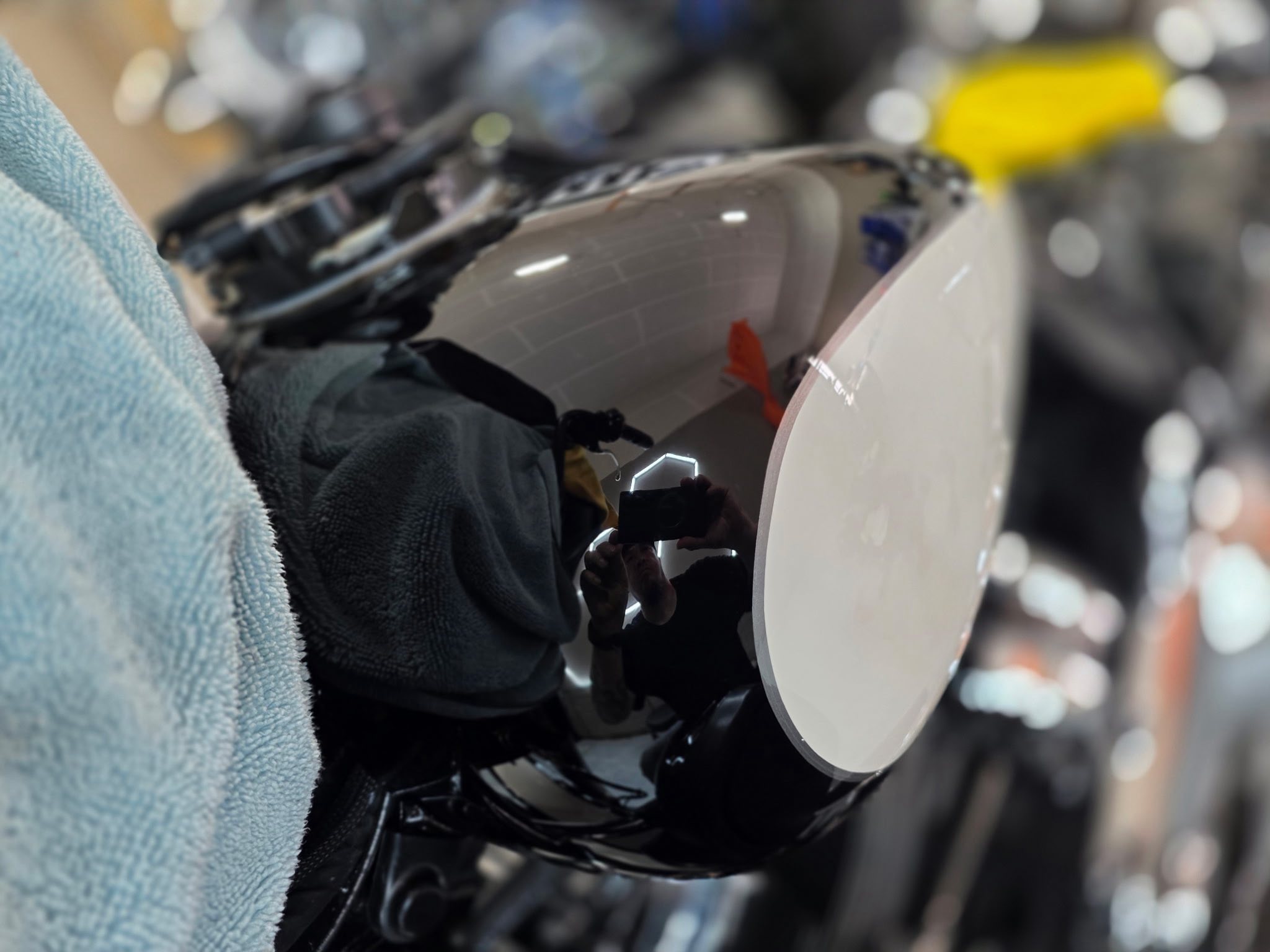 Close view of a polished motorcycle surface during detailing