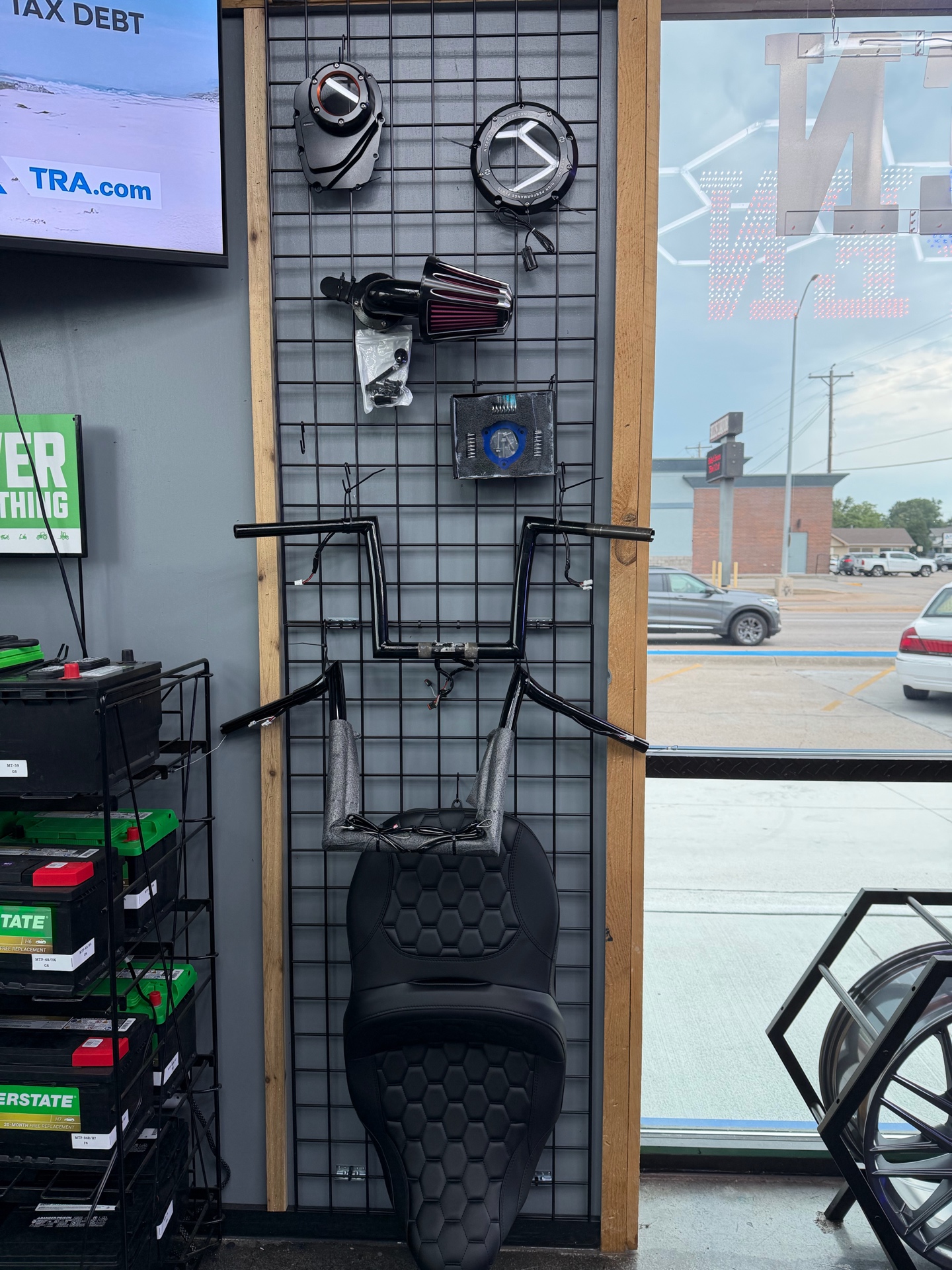 Motorcycle parts and accessories display inside Complete Automotive and Tires